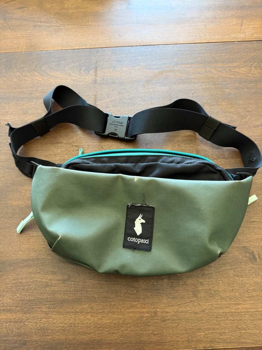 Cotopaxi Coso 2L Hip Pack Green with Teal Zipper and Black Strap